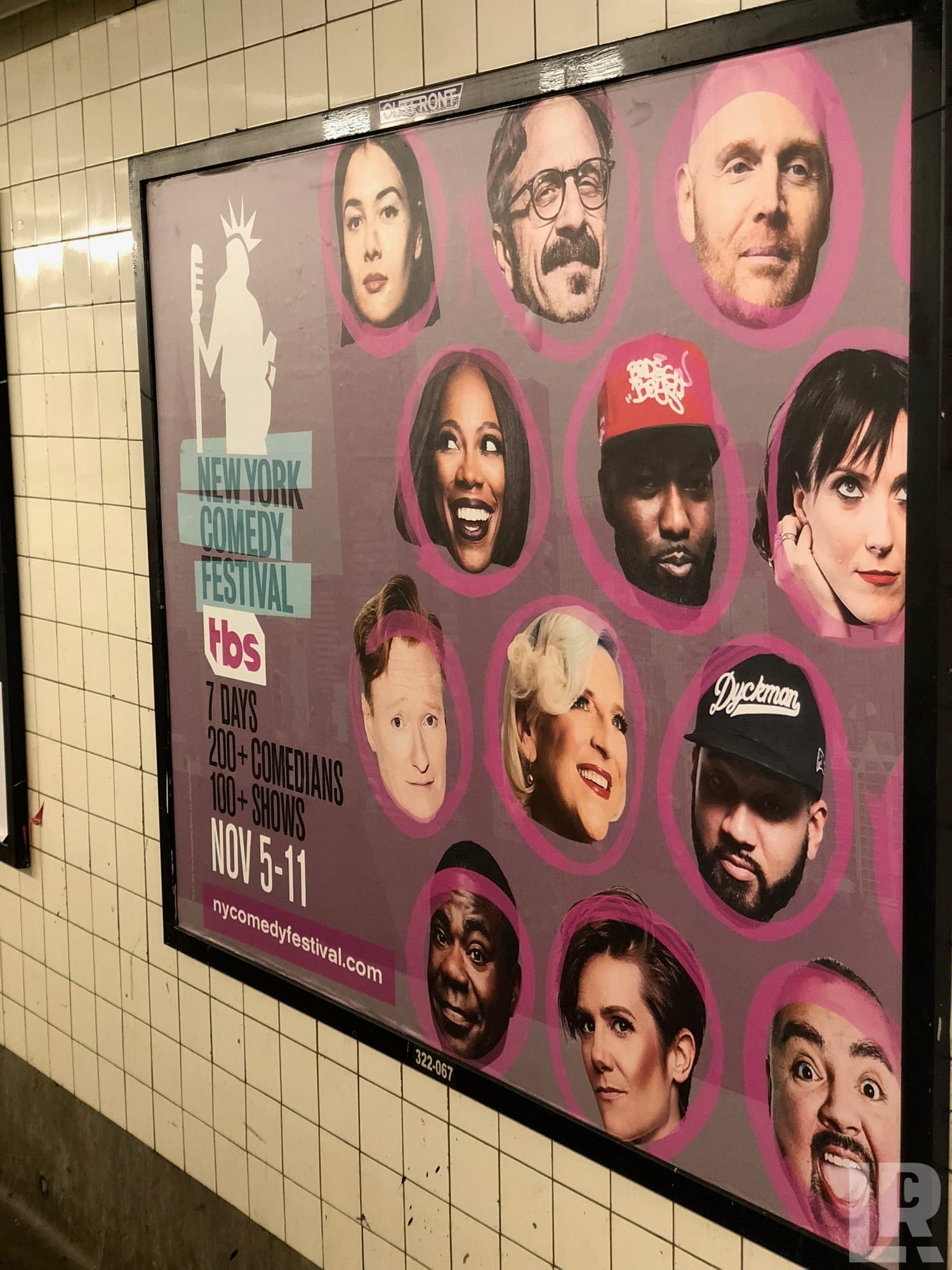 New York Comedy Festival TBS poster in a subway station showing comedian headshots, November 5-11